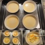 Fyra skålar med en ljus dessert som står på en metallplåt.